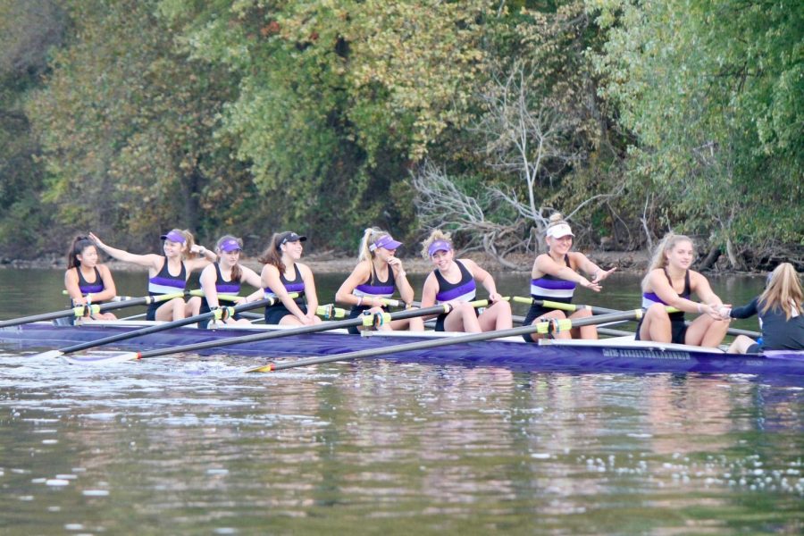 Rowers share a laugh in-between pieces at a fall practice 