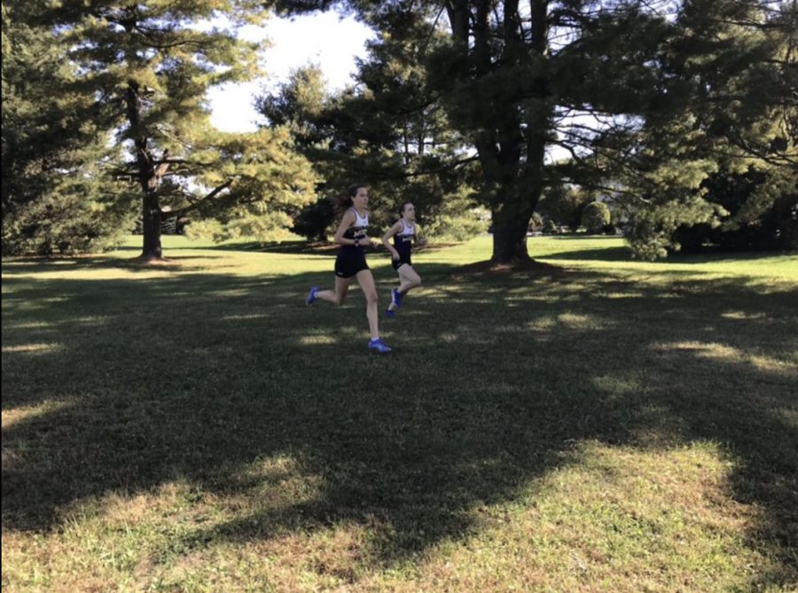 Two members of the Mount cross country team competing in a race.