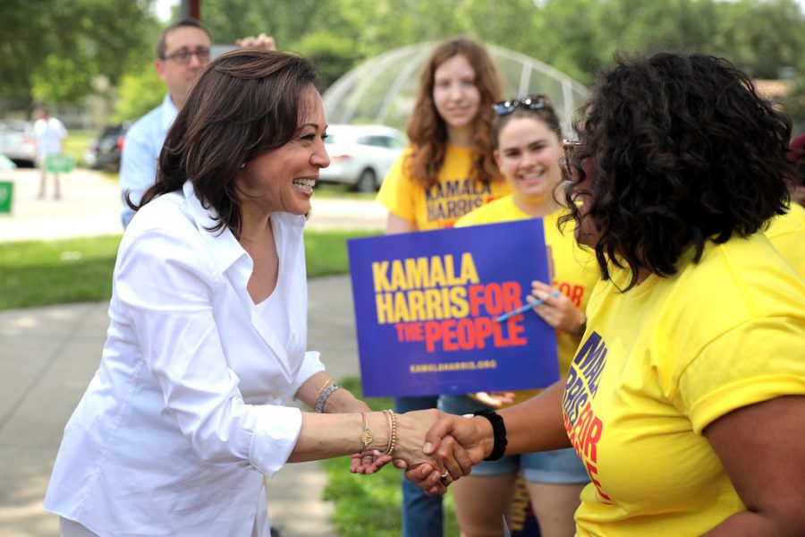 Vice presidential nominee Kamala Harris greets young supporters of her campaign.