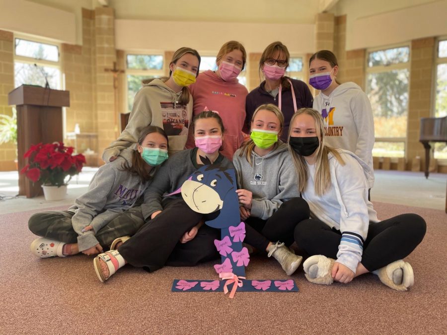 Small group 1 gathers for a photo with Mrs. Paula Soley and their number, made by small group leader and Mount alumna, Kasey McMahon '20 (bottom right).