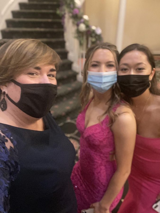 Mrs. Fabrey, Alexandra Ritter 21, and Hannah Rossmeisel 21 pose for a quick selfie before dancing the night away. 