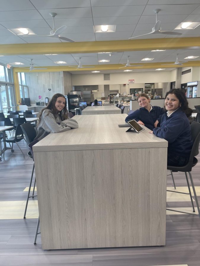 Natalie Fiorella 22, Bella, Feliciano 23, and Veronica Cherico 23, enjoy some small talk while testing out the new cafeteria countertops. 