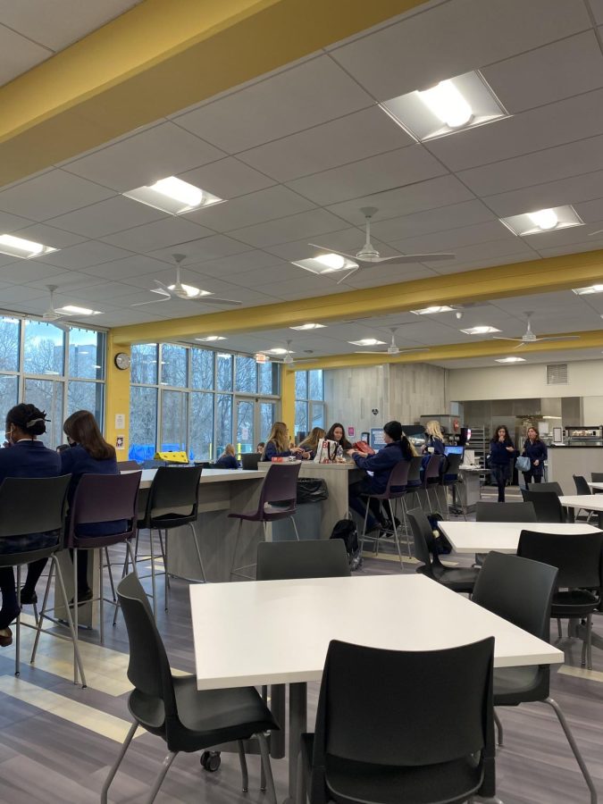 Students enjoy the new cafeteria furniture before school 
