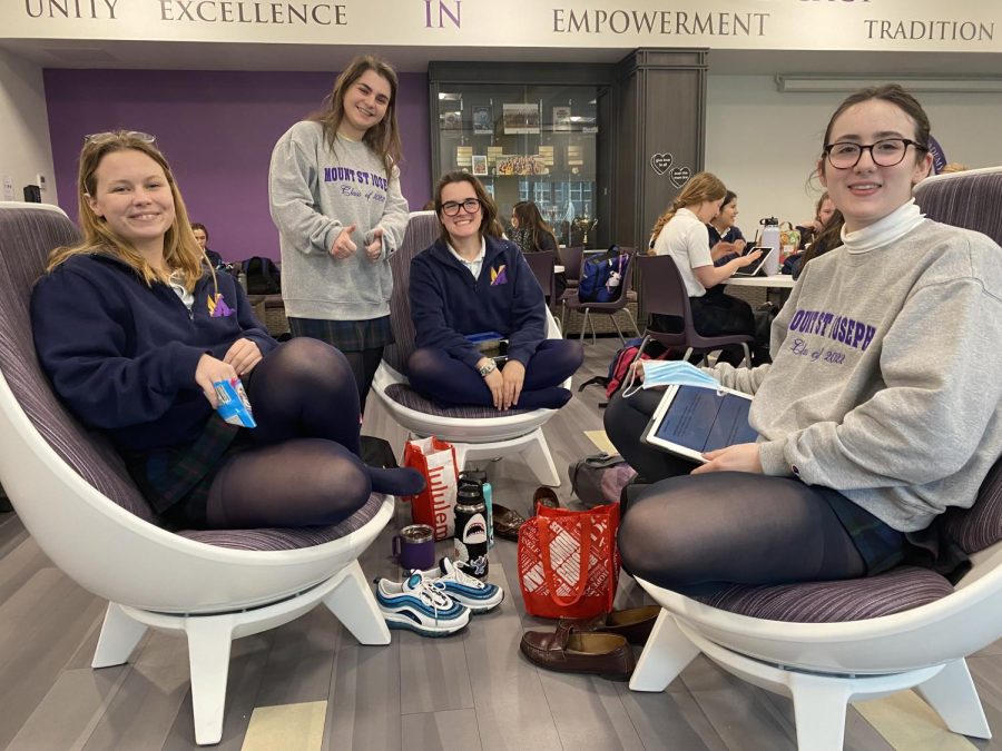 Grace Yaegel, Caroline Gola, Kate Kelly and Emma Gelone enjoy spinning and chatting while preparing for class. 