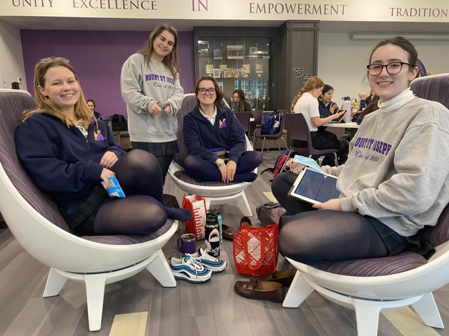 Grace Yaegel, Caroline Gola, Kate Kelly and Emma Gelone enjoy spinning and chatting while preparing for class. 