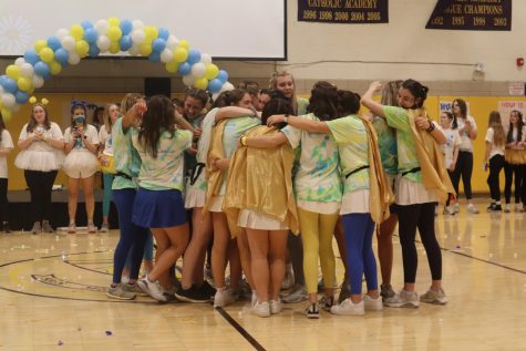 Magic-THON Committee engages in a group hug after the events of the night