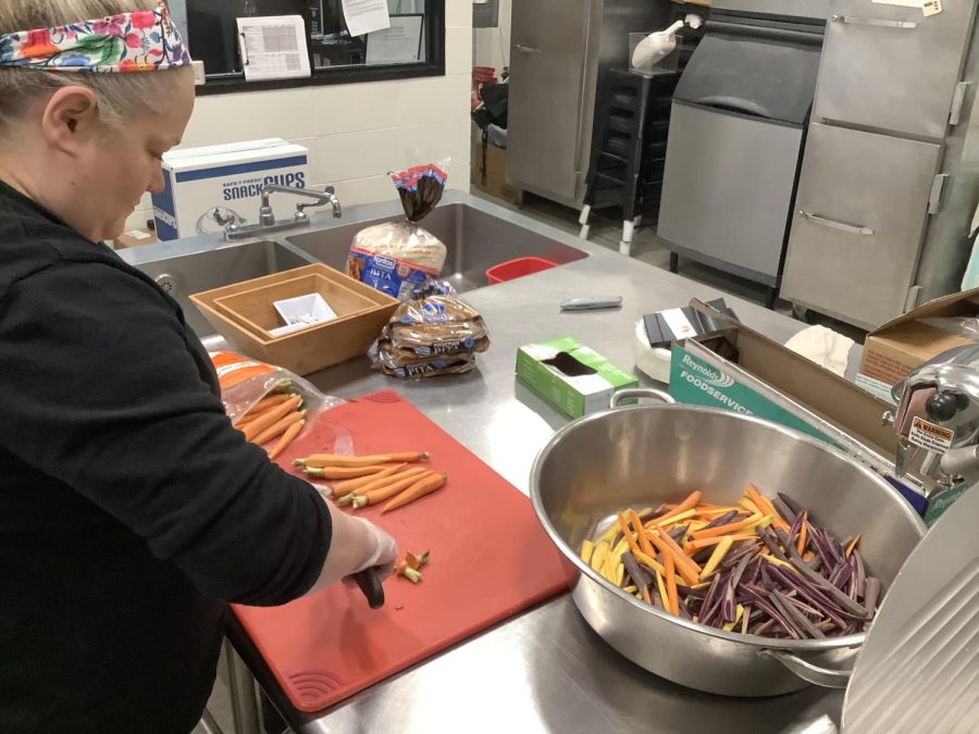Chef Jess prepares carrots and other vegetables that are usually featured on the menu.