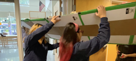 National Arts Honor Society members begin to move the art installation. 
