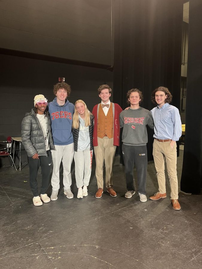 The cast of “Fusion Scientist,” a 2022 SNL skit, gets together on closing night for one last photo on stage. From left to right: Jalen WIlliams SJP ‘25, Will Clark SJP ‘23, Sarah Klunk MSJA ‘24, Jack Del Pizzo SJP ‘23, Brett Sparks SJP ‘25, Anthony McNamara SJP ‘23