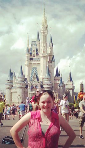 Ms. Kaminski standing in front of Cinderellas castle at the start of her internship at Walt Disney World. 