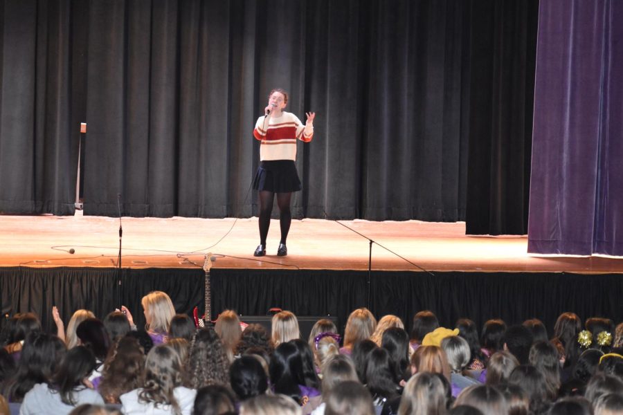 Remy Barrett '24 preforms a rendition of "Hopelessly Devoted to You" by Olivia Newton-John on Charity Day 2023. 