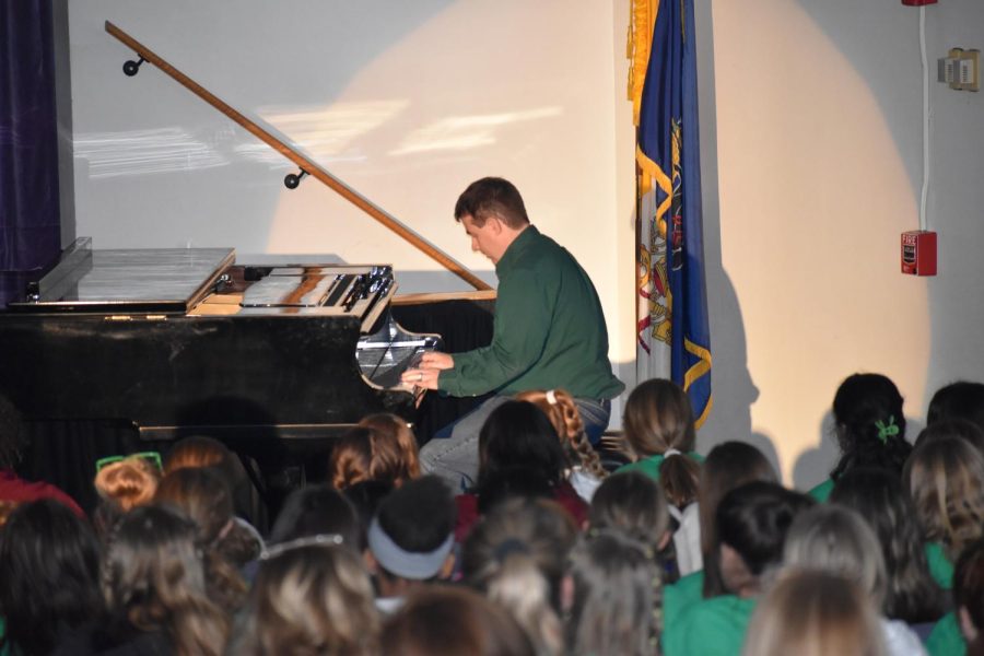 Mr. Dominick belts the lyrics to "Ode to Billie Joe" by Bobbie Gentry as he preforms his one-man-show during Charity Day 2023. Earlier in Spirit Week, he took on the piano as legendary piano man, Sir Elton John.