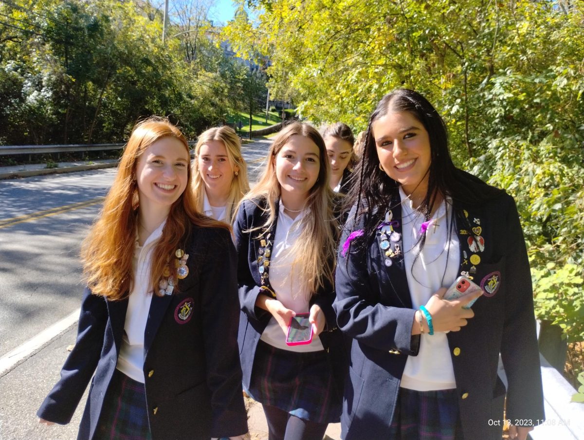 Addison Doxtader 24, Eva Kelly 24, Molly Maher 24 and Brooke White 24, all now seniors who have grown together throughout the years, walk as a group to during their final Founders Day walk.