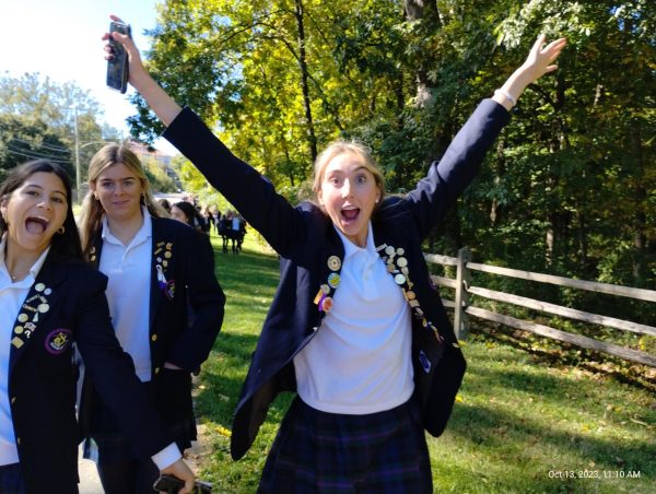 Audrey Kukla 24 lets her silly side out. Students enjoy the nature walk that has become a beloved feature of FoundersDay.