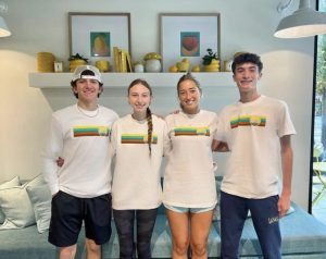 From left: Jace McGoldrick, Summer Delli Carpini, Lynley Koschineg, and Will Palopoli pause from their work day at Froot to smile for a picture. 
