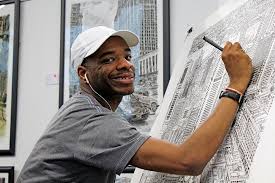 Stephen Wiltshire draws in his studio. 