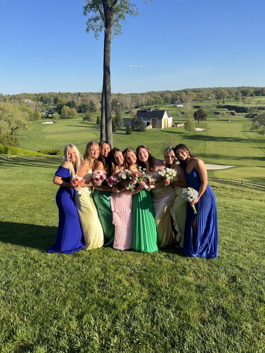 Molly Maher ‘24, Anna Ledwith ‘24, Maya McCottry 24, Anna Fedders 24, Michaela Kowalski ‘24, Caroline Johnson ‘24, Emily Feilke 24, and Ellie Fazio 24 hug each other for a photo at Manufacturers Country Club. Other places seniors took photos included North Hills Country Club, Temple Aboretum, Sandy Run Country Club, and Old York Road Country Club.