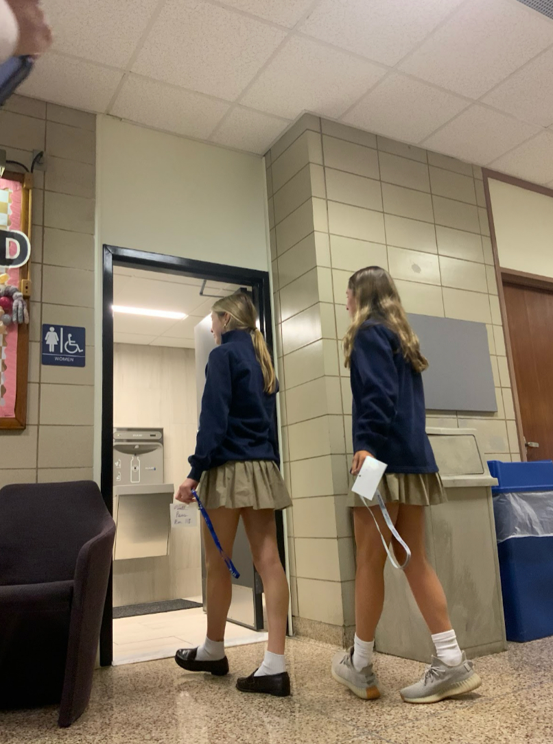 Sarah Deitch ‘26 and Jill Marcelina ‘25 utilizing the new mandatory lanyard hall passes from Ms. Gallon’s classroom to go to the restroom during advisory time. 