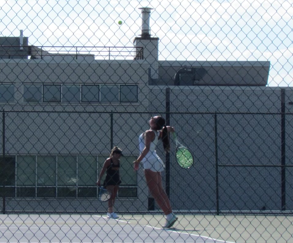 Savana Paris ‘26 works hard in her doubles tennis match against Gwynedd. 