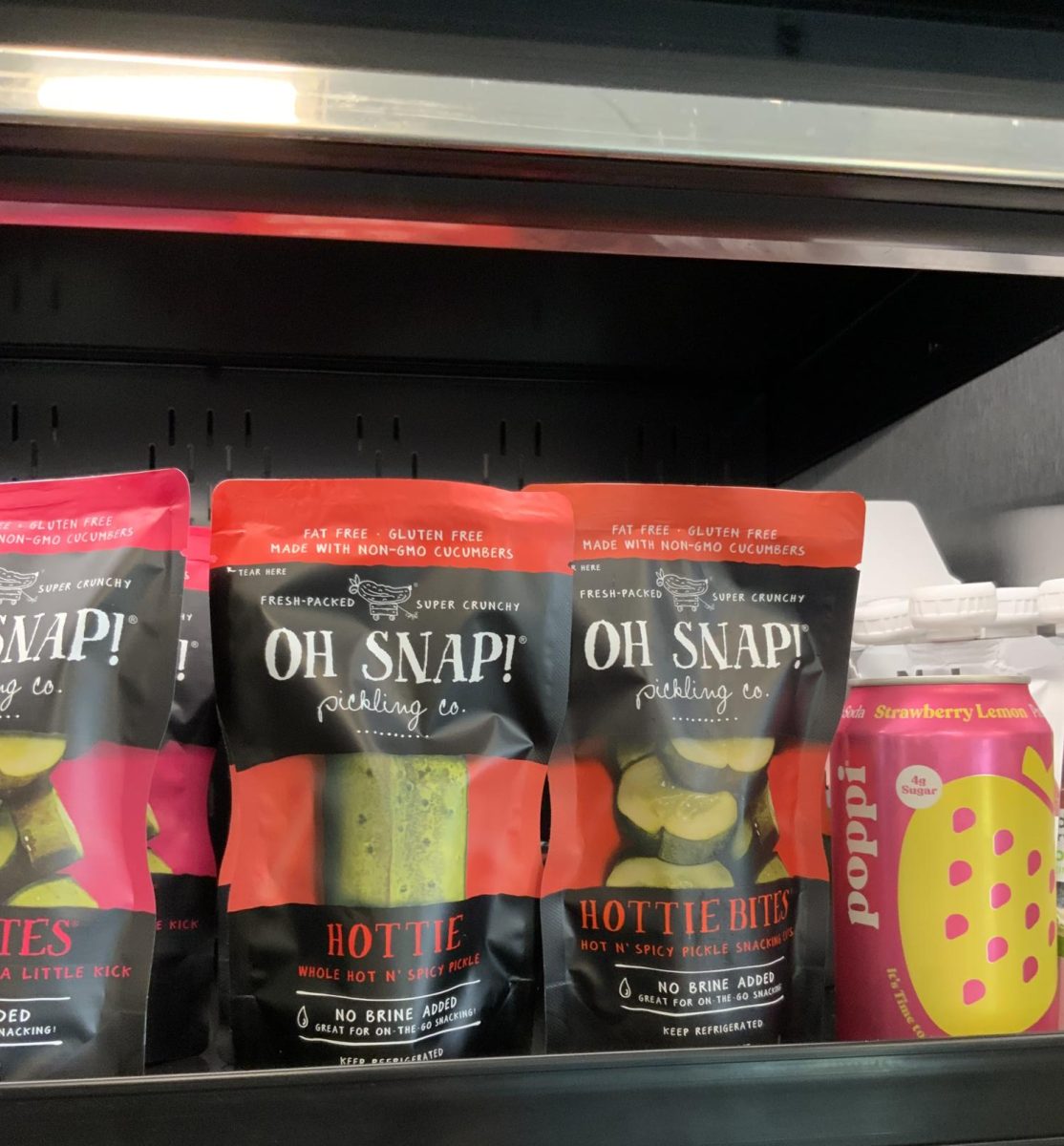 Gabby ‘27 always goes for the “Oh Snap!” spicy pickle bites which are packaged in bags, many students say this snack is commonly seen at Wawa. Gabby cracks open a strawberry lemonade poppi to wash down the spice.

