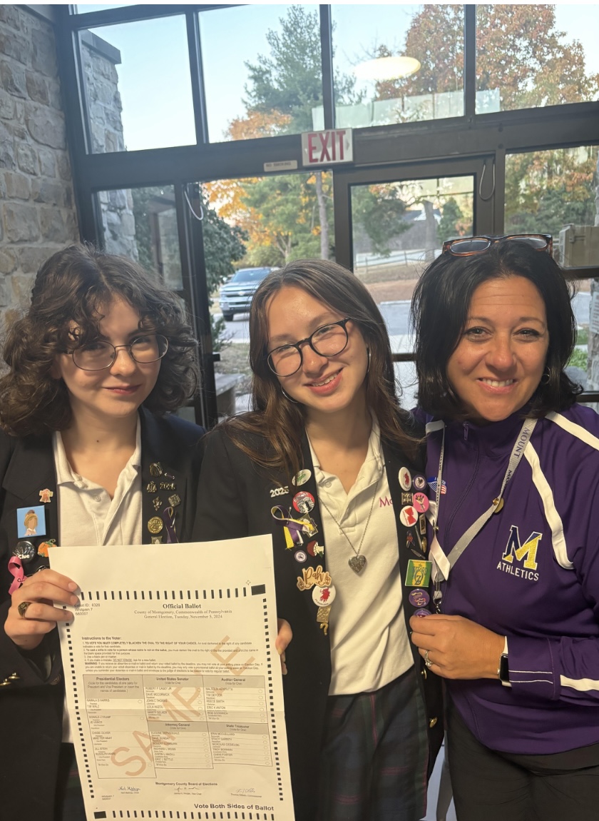 Sofia Glantz, Paige Carson and Mrs. Schools smiling ear-to-ear eagerly waiting for voters.