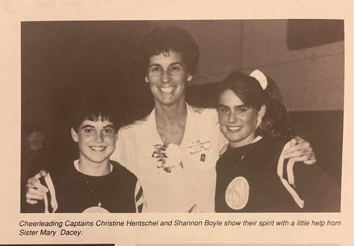 A beaming Sister Mary Dacey pictured in the October 1990 edition of The Campanile with two Mounties. 

"On our Freshmen trip to Disney, Sr. Mary and Sr. Charlene were two of the chaperones. It was the first time, after being in Catholic school my entire life, that I was able to see that Sisters can be funny, cool and relatable!“ Lauren Hankins '98, Assistant Athletic Director, said. 
