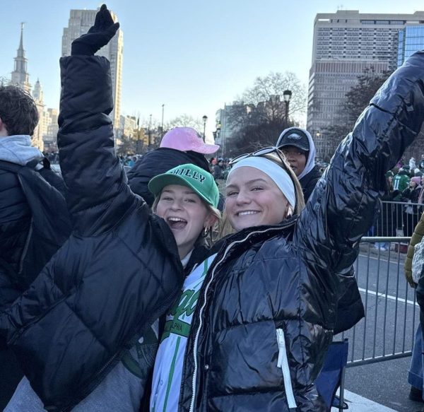 Avery Lasky ‘26 and Allie Seweryn ‘26 raise their hands out of excitement for the Birds! 

After this photo the Eagles float drove by.  