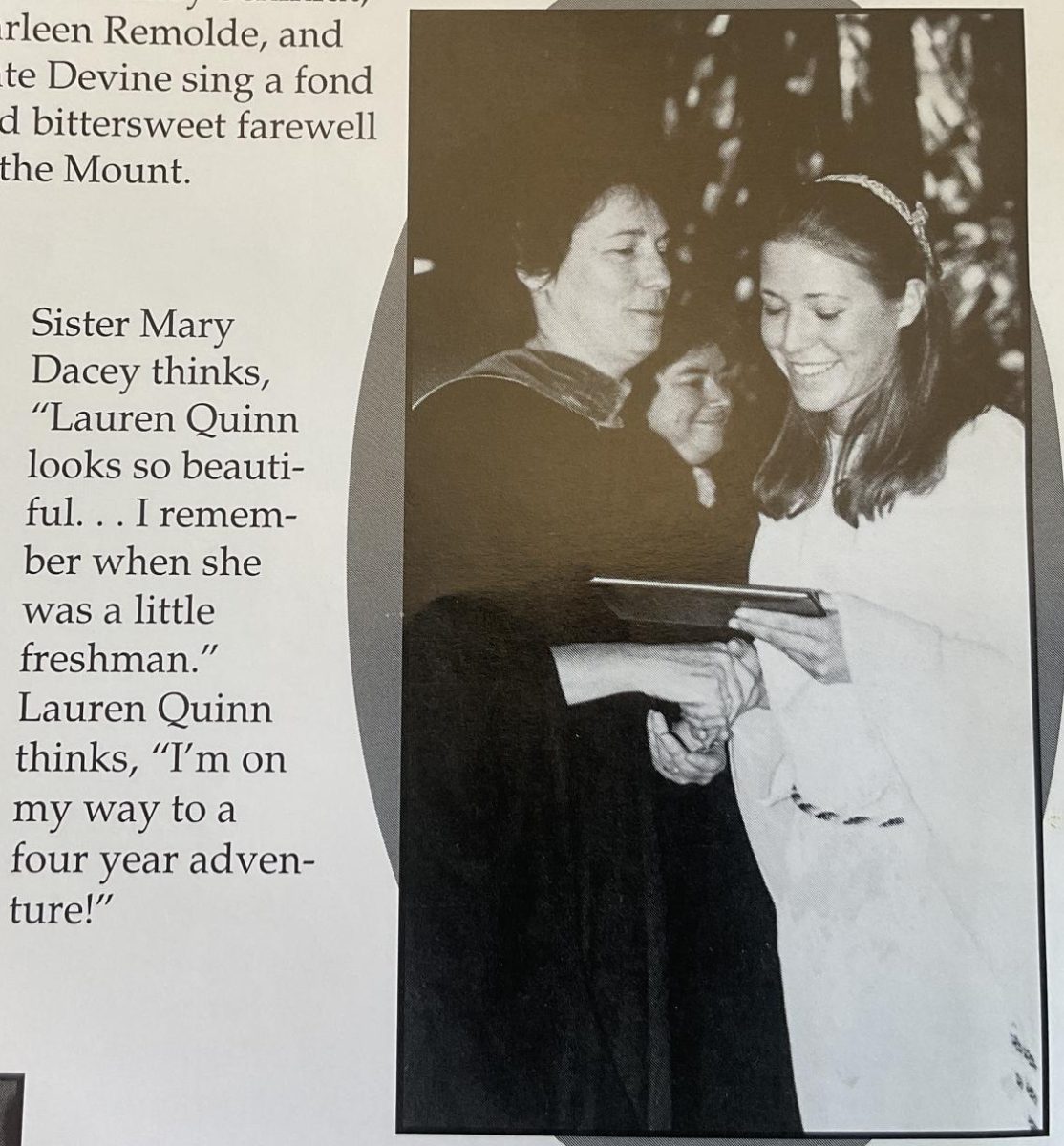 Sister Mary Dacey proudly hands student, Lauren Quinn, her diploma. 