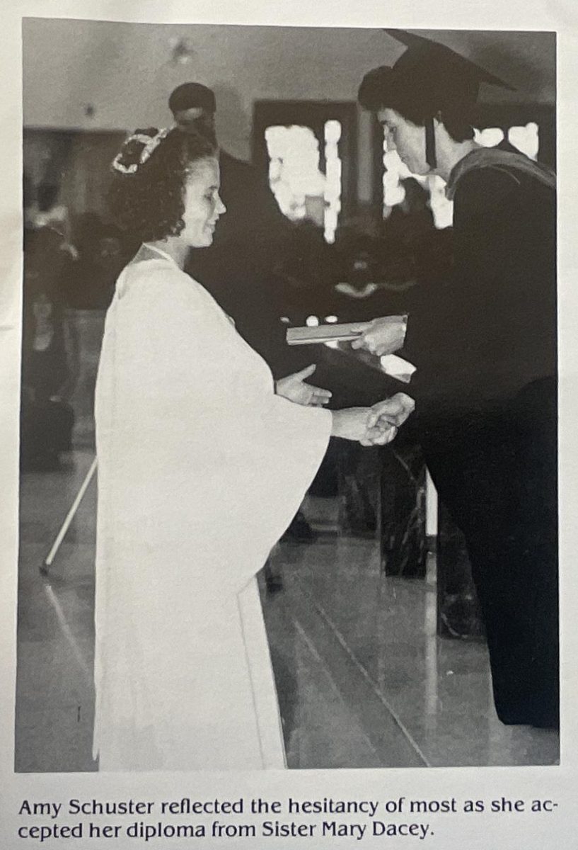 Sister Mary Dacey gives a Mountie her diploma in 1994. 