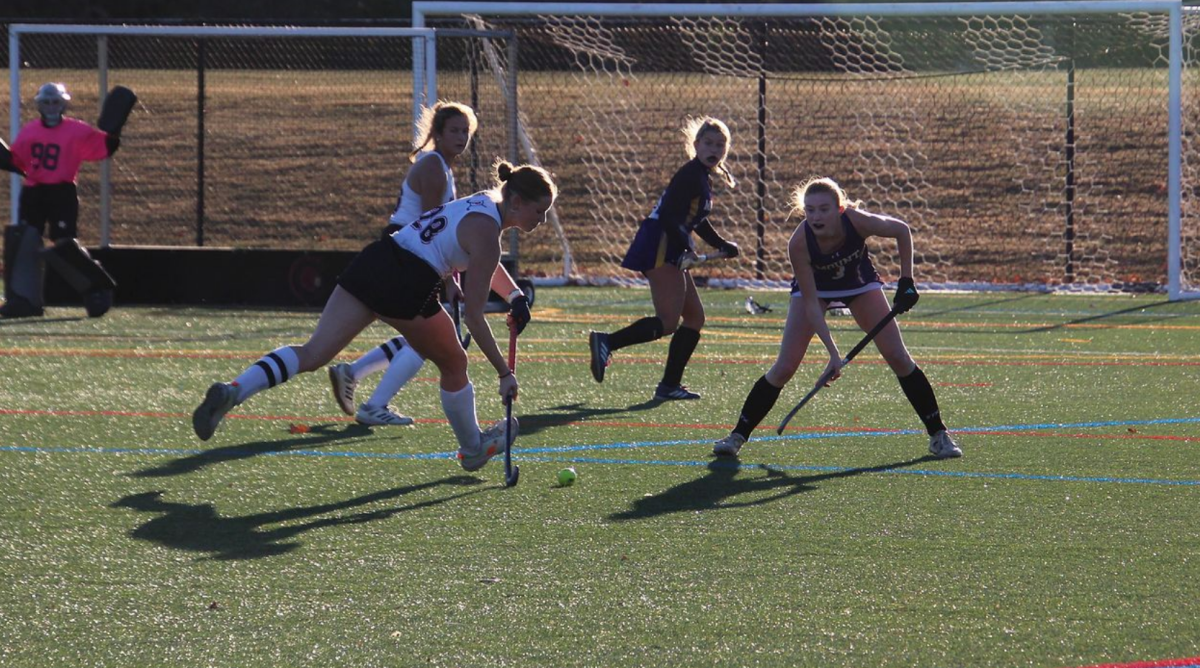 Avery Lasky '26 defends as Julia McGlynn '27 attacks the ball. 