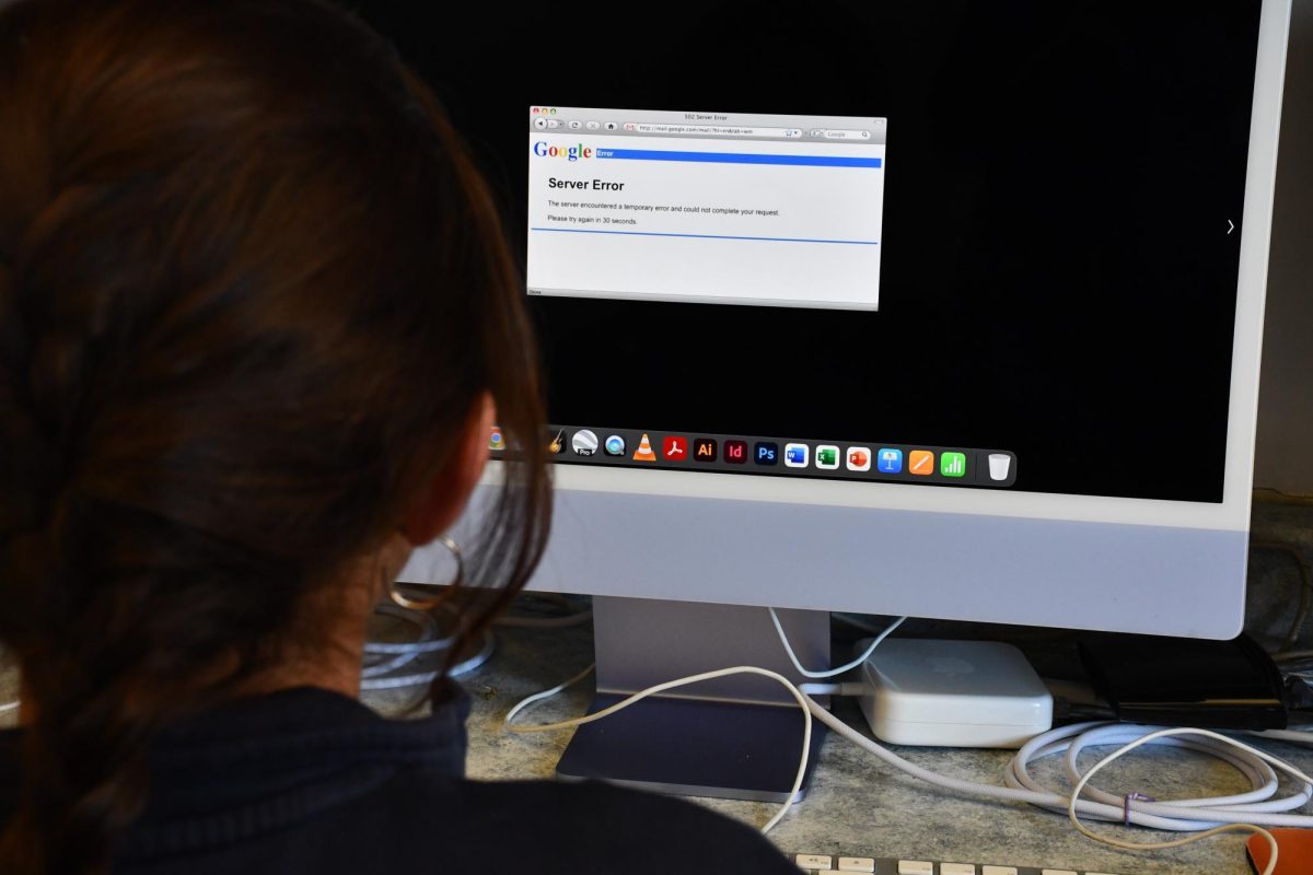 A student looks at a screen with an error message. 