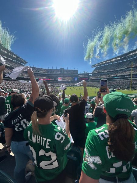 Fans cheer as The Eagles game kicks off with a bang.