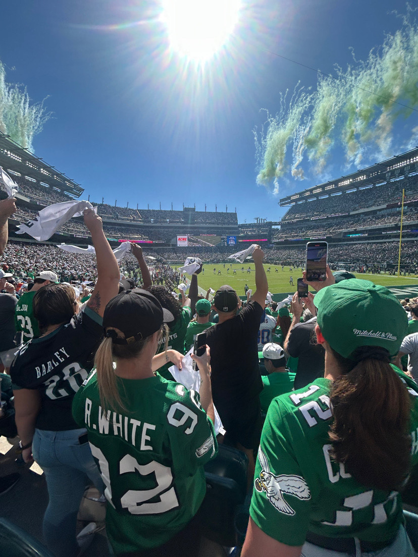 Fans cheer as The Eagles game kicks off with a bang.