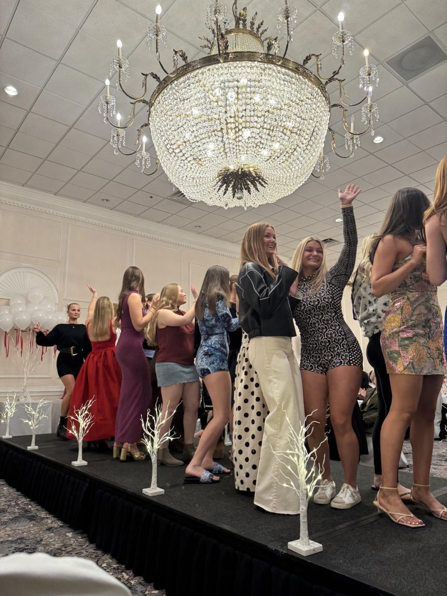 Models flood the runway at the end of the show. 