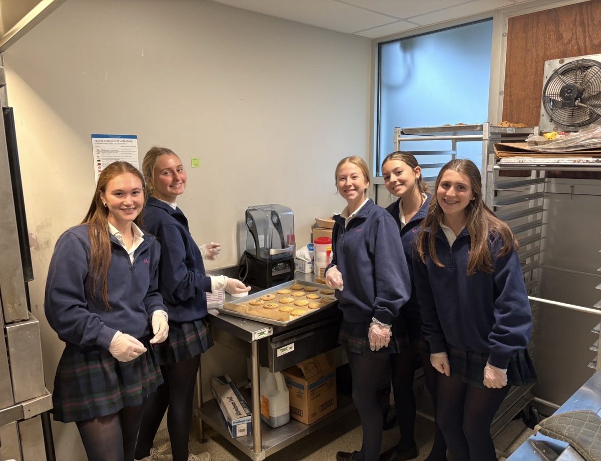 Girls on the Healthy Relationship Team making cookies for the thanksgiving food drive. 