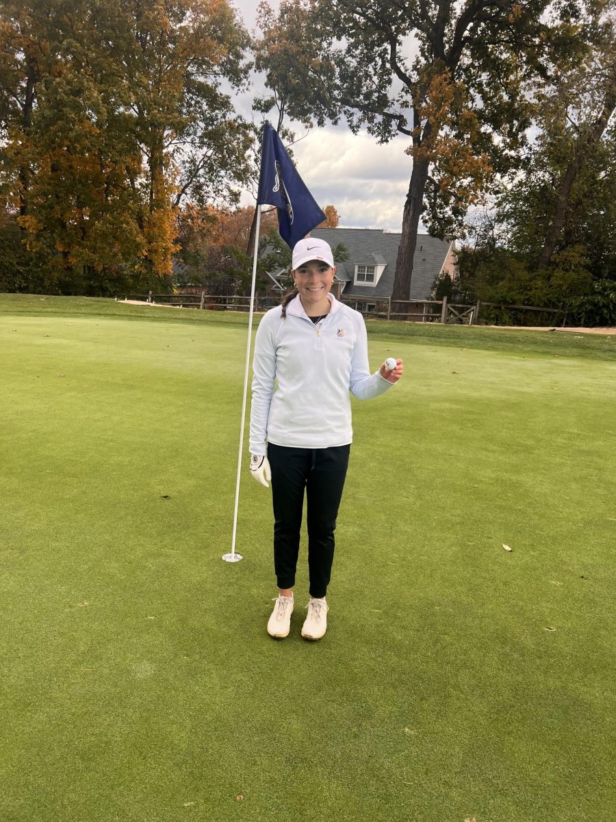 Michaela Ianieri standing on the green after she hit her first career hole-in-one. 