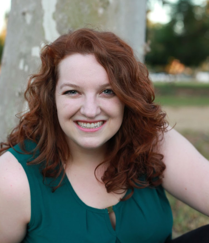 Tiffany poses for a professional headshot.
