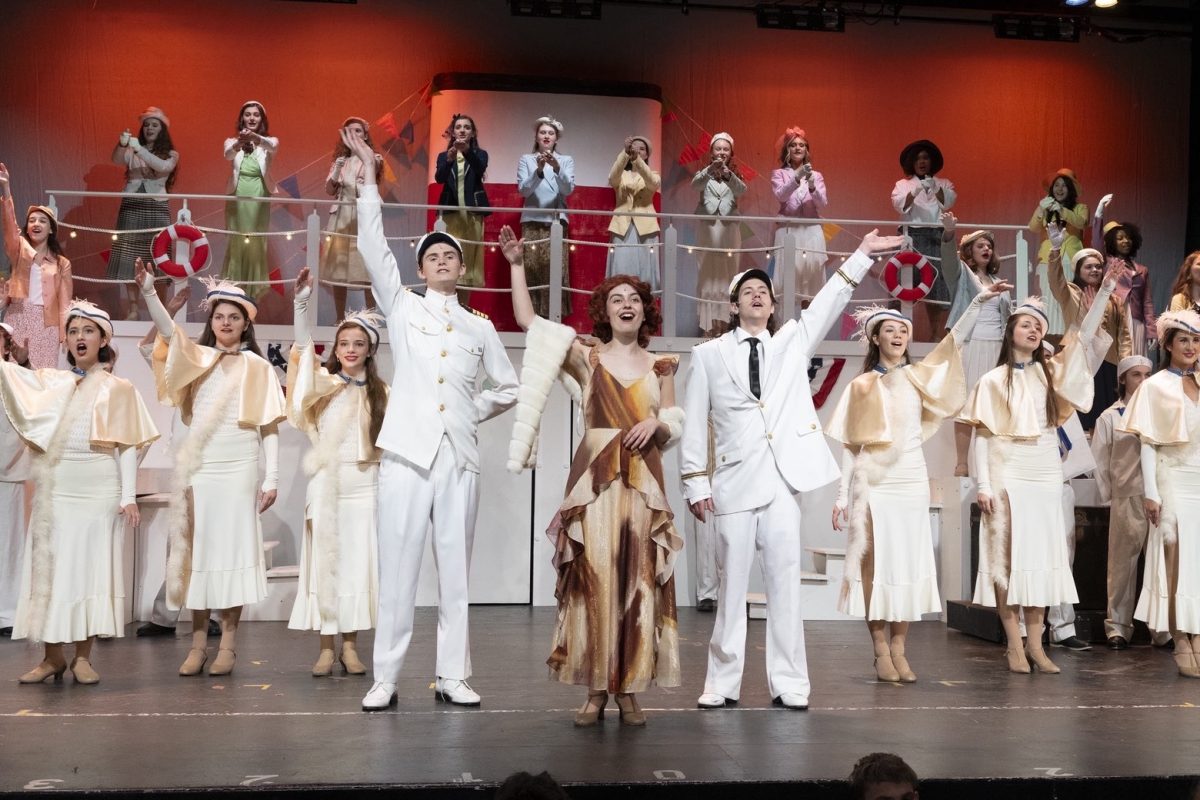 Grace Balkowski ‘26, Dan Cogan LSCHS ‘27, and Pete Augustine ‘28 theatrically wave to the audience.