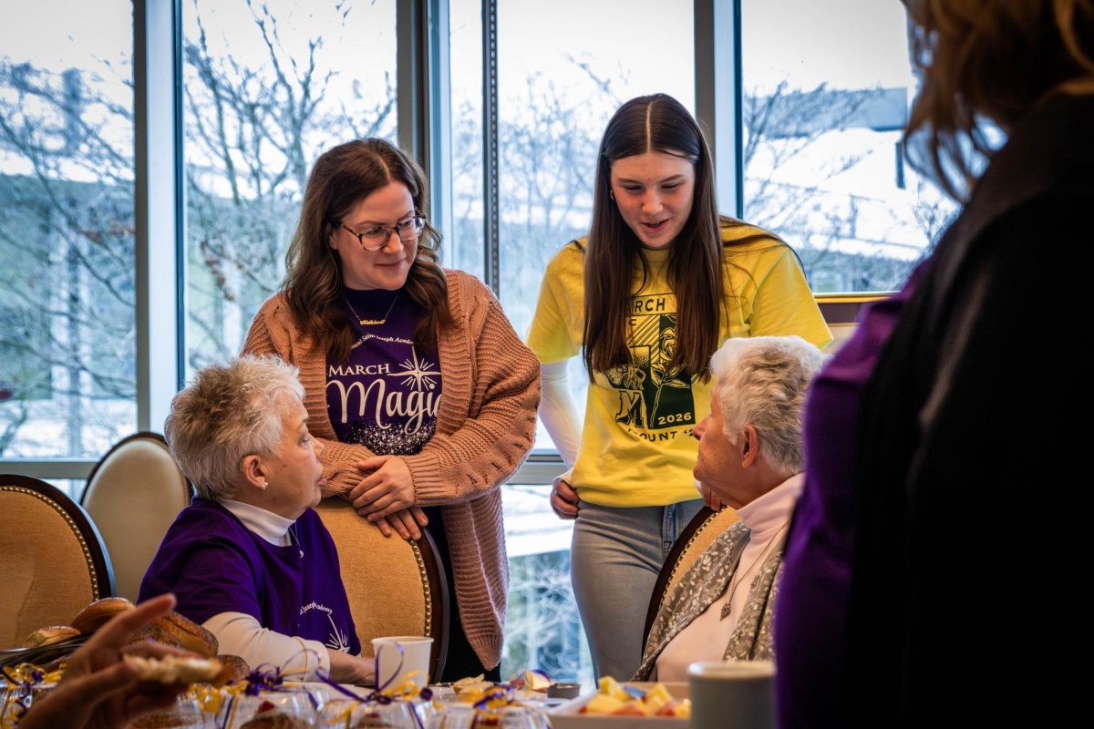 Ms.Ochs who is head of the religion department chatting with a Sister of Saint Joseph. 
