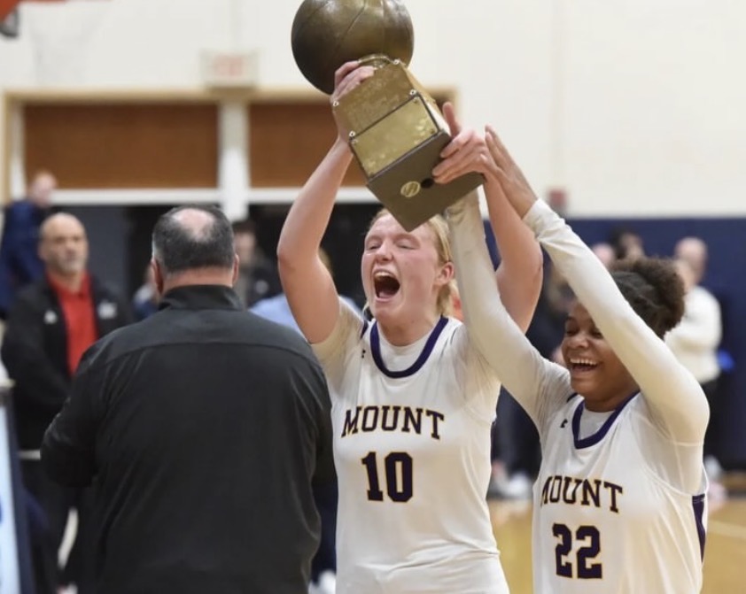 Bridget Horgan holds the ACAA trophy after the winning game at LaSalle College High School.